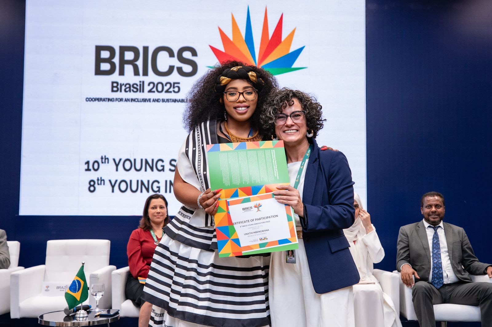 Unathi receiving BRICS Young Innovator Prize nomination